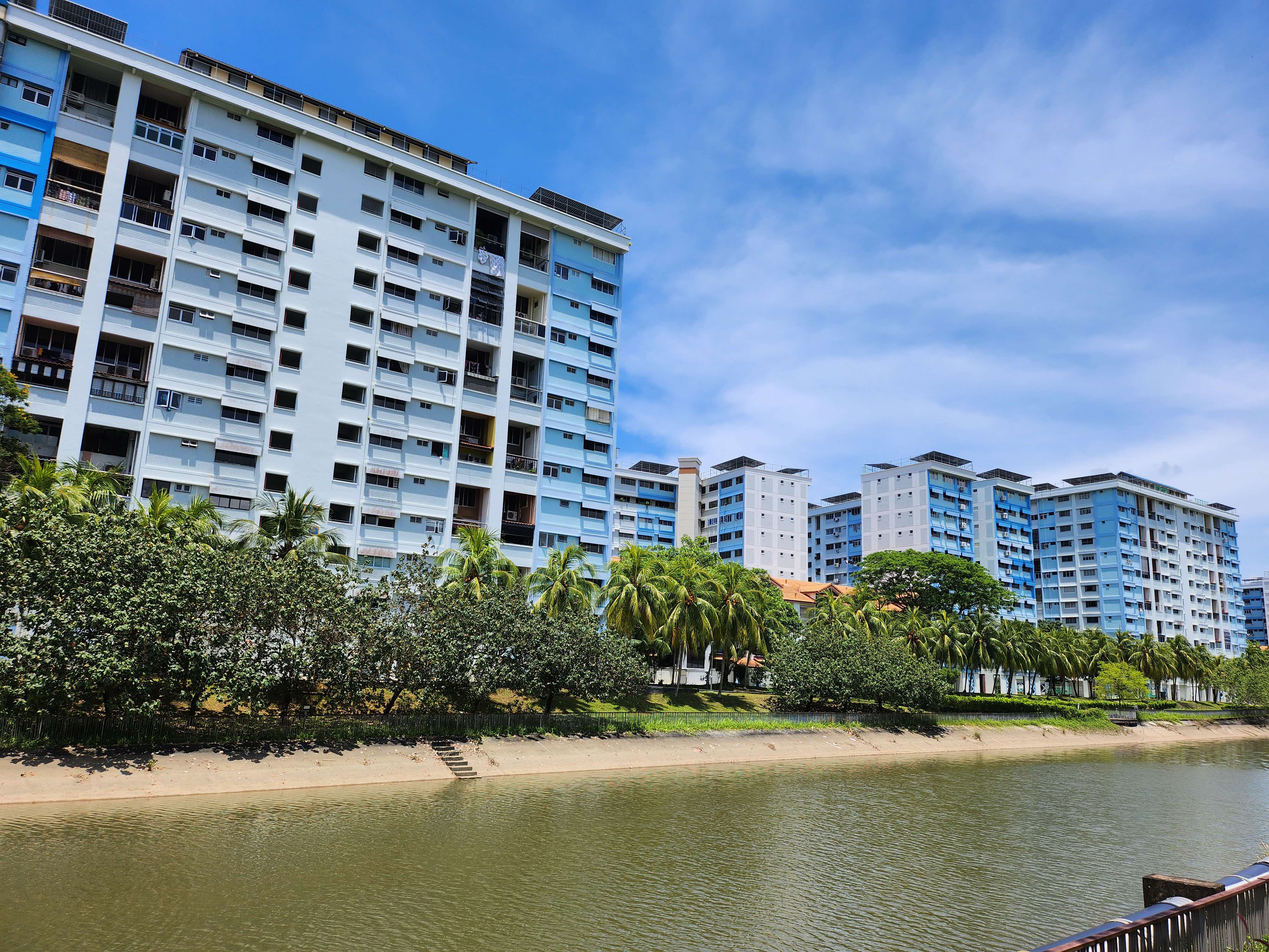 Housing and Development Board flats along Sungei Tampines, 2023. Before the development of Pasir Ris, kampongs  were once found by the banks of the river. Photo by Asrina Tanuri.